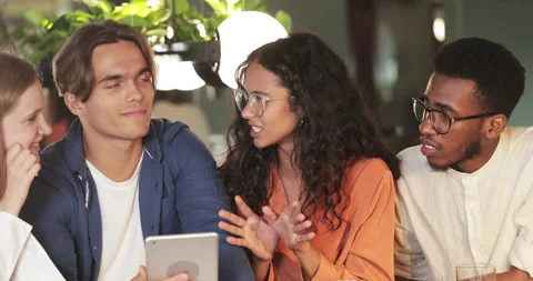 Close up view of young startuppers talking and using tablet. Millennial multi Video stock 133265026