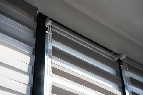 Close View of Zebra Window Blinds Filtering Daylight Stock Photos