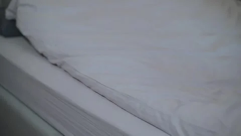 Close-up views of a neatly arranged bed with clean sheets and pillows. Stock-Footage 337112871