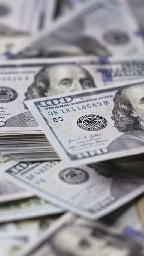 Close-up views of stacks of U.S. hundred-dollar bills arranged in various Stock Footage 328124748