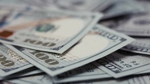 Close-up views of US dollar banknotes stacked in a disordered arrangement, Stock Footage 327717180