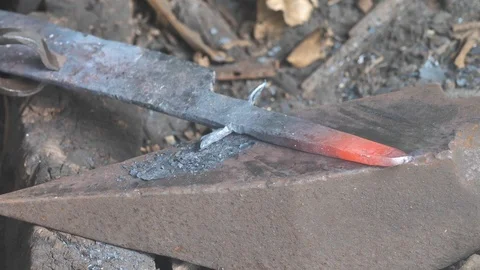 Close Up of Village Blacksmith Working With Hot Metal in Rural Madagascar Stock Footage 125355236
