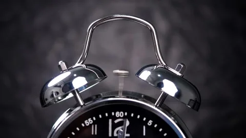 Close-up of vintage alarm clock ringing Stock Footage 143373711