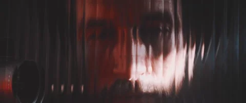 Close up of vintage camera and mans face thourgh clear panel in red lights Stock Footage 203571093