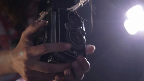 Close up of vintage camera female photographer with retro camera in studio Stock Footage 89853292