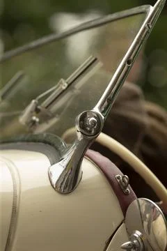 Close-up of vintage car windshield hinge and chrome trim Stock Photos