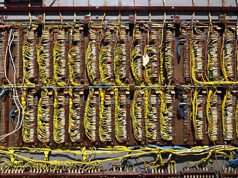 Close-up of Vintage Circuit Wiring Panel with Yellow Cables Stock Photos