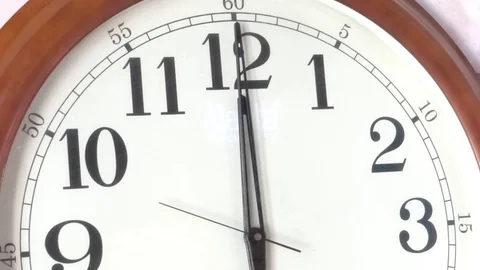 Close-up of a vintage clock face at 12 oclock with a second hand moving Stock Footage 114970725