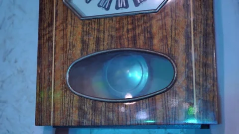 Close-up of a vintage clock pendulum swinging back and forth.vintage clock Video stock 249838451