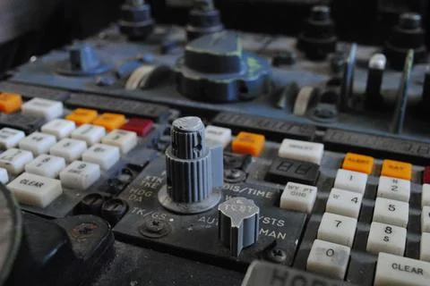 Close-up of a vintage control panel with numerous buttons and knobs Foto stock