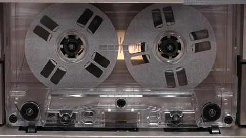 Close-up of vintage deck recorder, wheels of rewinding cassette tape Stock Footage 121168597