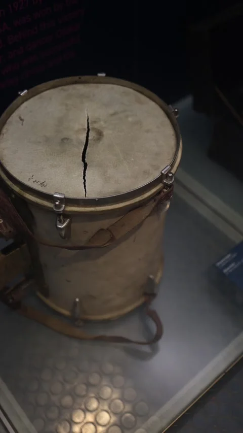 A close-up of a vintage drum with a cracked drumhead, showcasing its aged textur Stock Footage 293470975