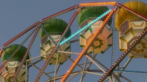 Close Up of Vintage Ferris Wheel with Lights at Sunset - 4K Stock Footage 343579712