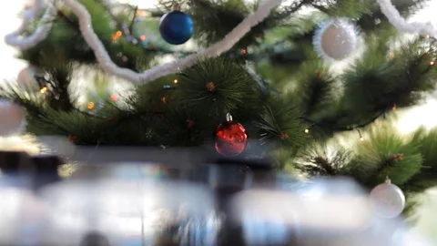 Close up: Vintage gramophone play back vinyl plate. Background: Christmas tree. Stock Footage 70796404