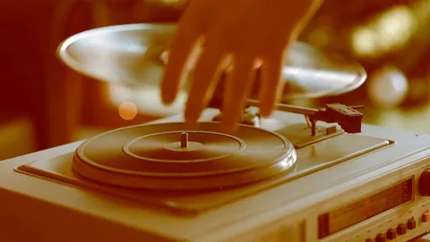 Close up: Vintage gramophone play back vinyl plate. Background: Christmas tree. Stock Footage 70797906
