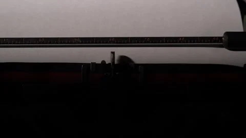 Close up of a vintage manual typewriter typing a cryptic message on paper Video stock 322911753