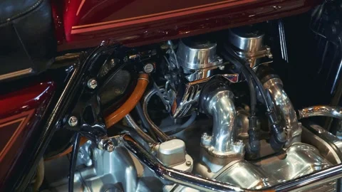 Close-up of vintage motorcycle engine shining in outdoor setting Stock Footage 340880803
