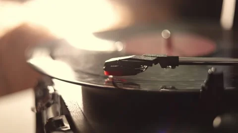 Close-up of a vintage record player needle tracking the grooves of a spinning Stock Footage 337104434