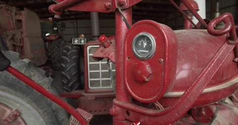 Close-Up of Vintage Red Tractor Dashboard in Farm Shed Stock Footage 333227937