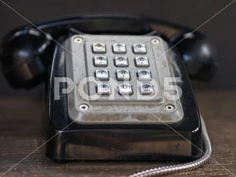 Close-up of vintage / retro black phone with silver metal push buttons Stock Photos