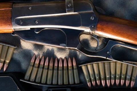 Close up of a vintage rifle in a case, next to ammunition Stock Photos