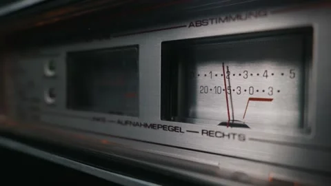 Close-Up of a Vintage Stereo Receiver Vu Meter with German Text on Faceplate Stock Footage 333818611