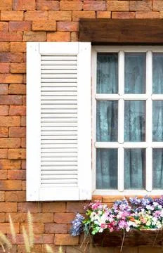 Close up vintage white window frame on antique brick wall Stock Photos