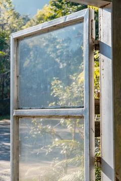 Close up of a vintage white window frame in sunlight Stock Photos