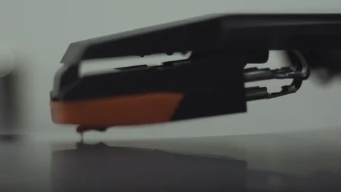 CLOSE UP OF VINYL PLAYER COMING TO A STOP Stock Footage 126236503