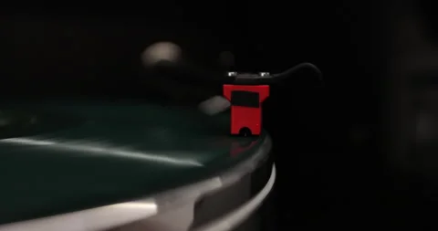 Close-up of a vinyl record and a turntable needle. Vintage vinyl record player. Stock Footage 296391001