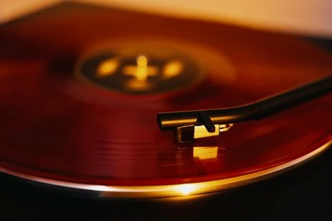 Close up of a vinyl record player with a red record Stock Photos