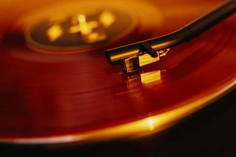 Close up of a vinyl record player with a red record Stock Photos