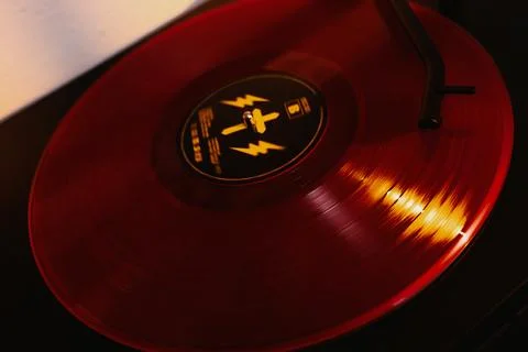 Close up of a vinyl record player with a red record Stock Photos