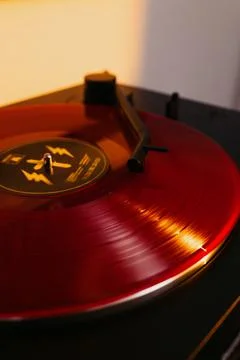 Close up of a vinyl record player with a red record Stock Photos