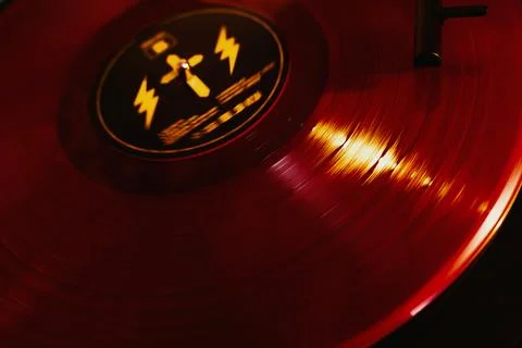 Close up of a vinyl record player with a red record Stock Photos