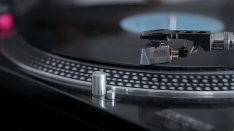 Close-up of vinyl record spinning fast on DJ turntable Stock Footage 149796956