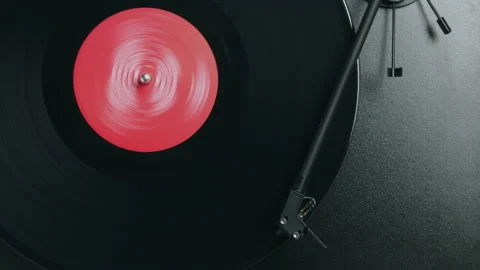 Close Up of Vinyl Record Spinning in Stop Motion on Turntable Stock Footage 148666740