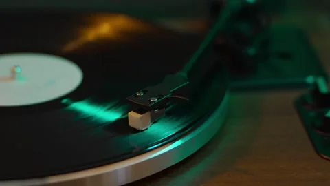 Close-Up of Vinyl Record Spinning on Turntable with Stylus Stock Footage 313708239