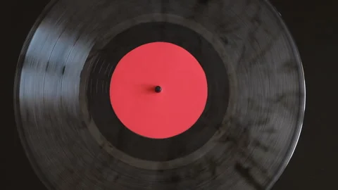 Close up of vinyl record spinning on turntable Video stock 331312415