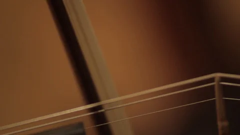 Close up on violin bow playing long notes Stock-Footage 86531559