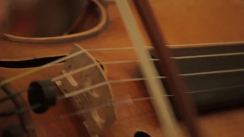 Close up of Violin bow playing strings 스톡 동영상 86532388
