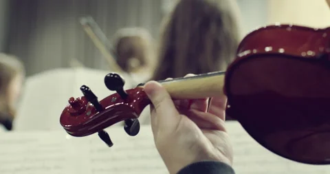 Close-Up of a Violin During Orchestra Practice Видео 296586608