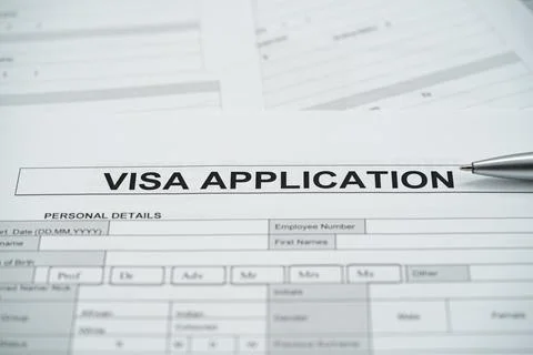 Close up of visa application form with pen on personal details section Stockfoto's