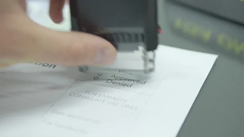 Close up visa application paper and stamp approved Stock Footage 248698954