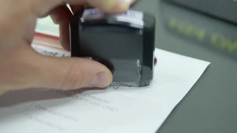 Close up visa application paper and stamp approved Stock-Footage 248699395