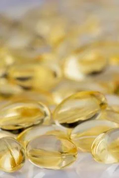 Close up Vitamin E Capsulus on a white background Stock Photos