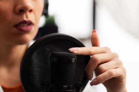 Close up of vlogger tapping microphone before make youtube video Stock Photos