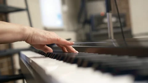 Close up vocal lesson. The teacher's hands plays piano Video stock 265674762