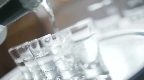 Close-up of Vodka Poured into a Shot Glass Stock Footage