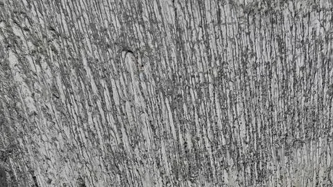 A close-up of the volcanos textured surface reveals intricate patterns etched by Foto stock